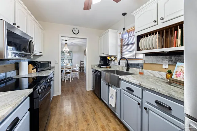 a bedroom with a bed and a mirror