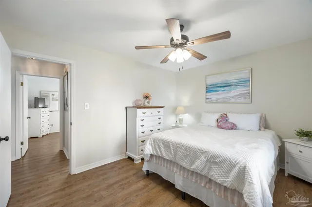 a living room with furniture and floor to ceiling windows