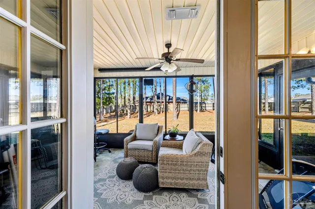 a view of a house with a tree in the yard