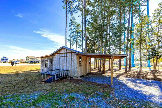 an aerial view of residential houses with outdoor space and swimming pool