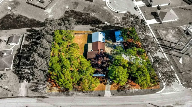 a view of a backyard with sitting area