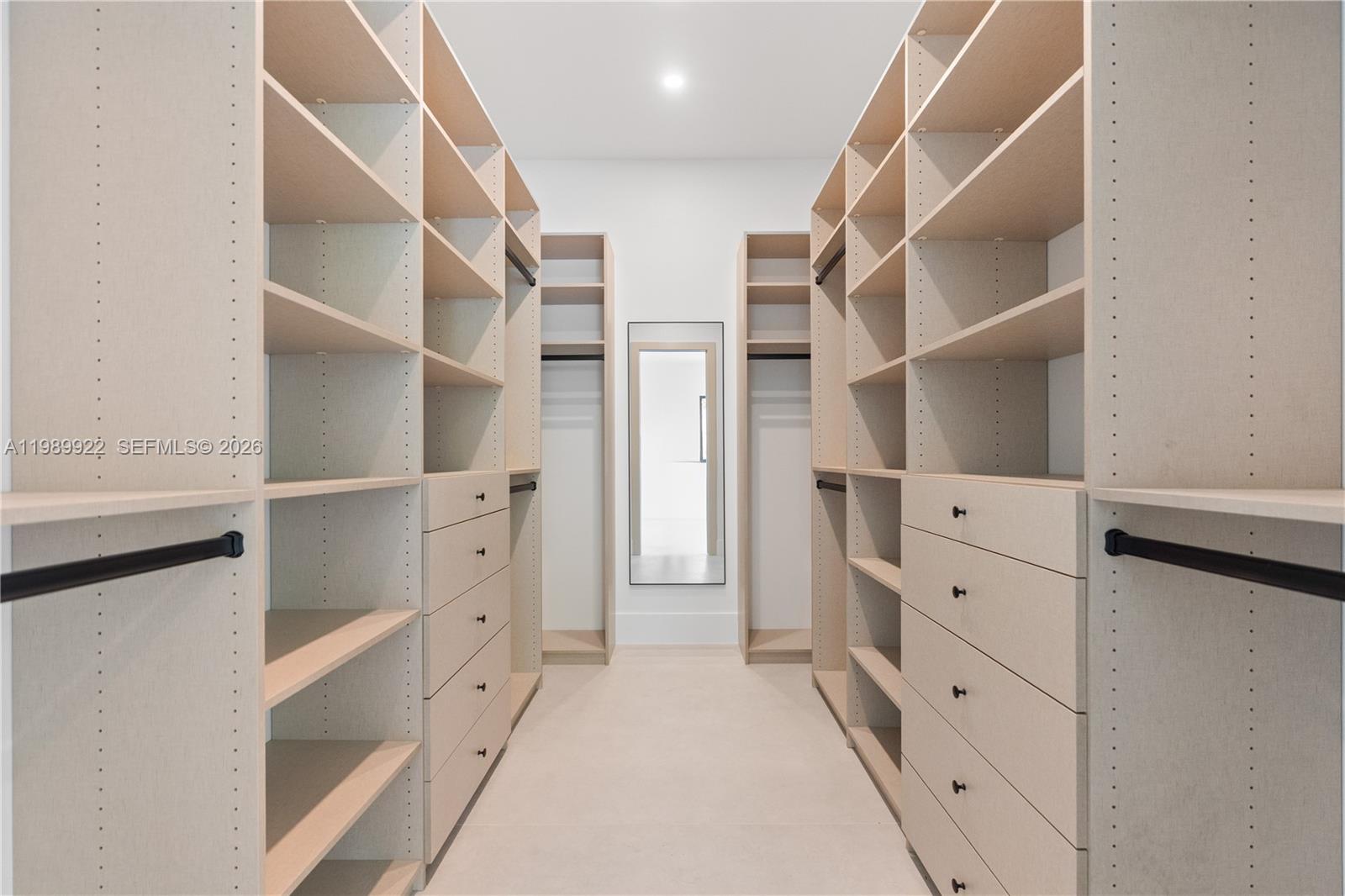 6221 Southwest 60th Street South Miami, FL 33143 - Photo 21 of 42 a view of walk in closet with empty racks