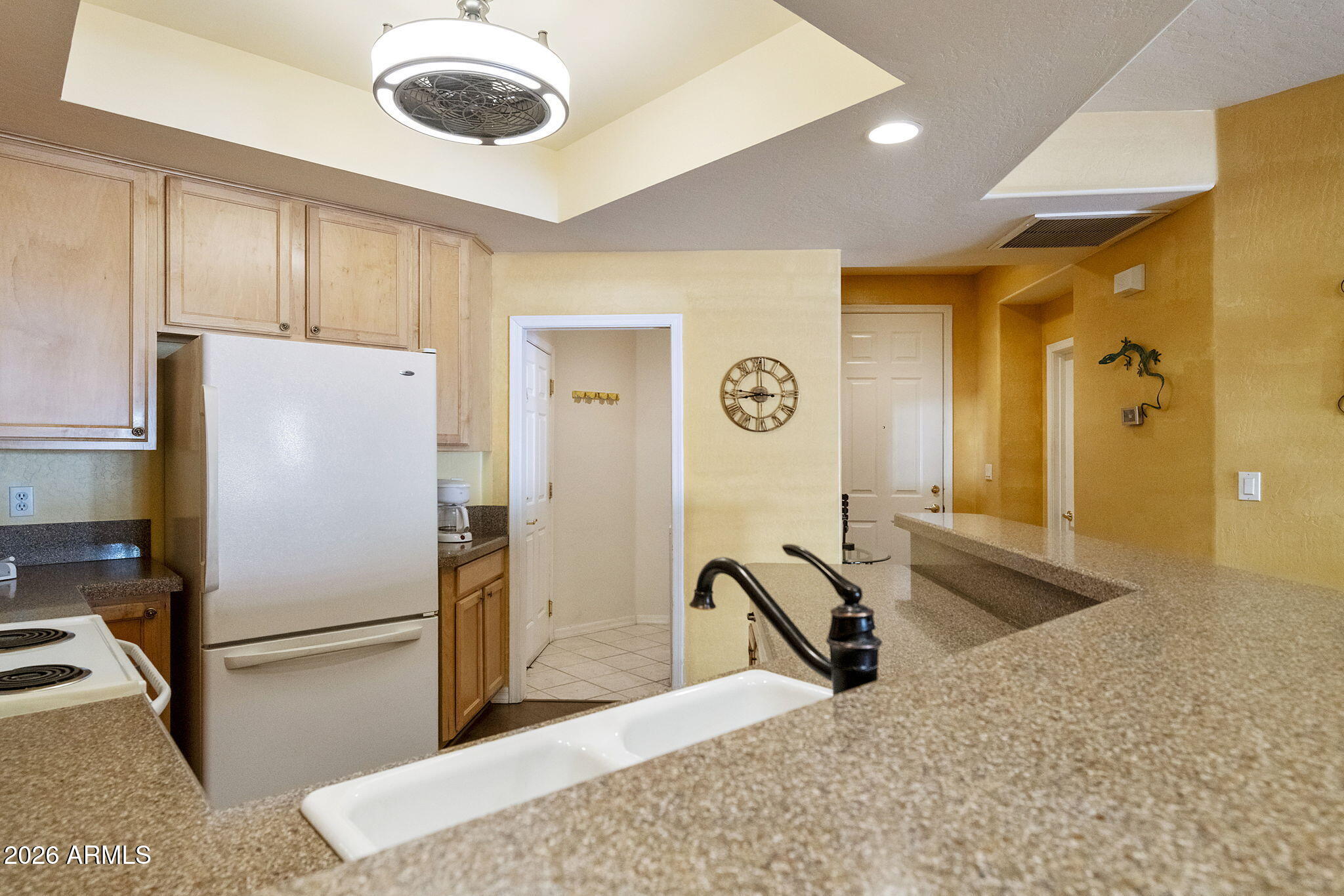 4202 East Broadway Road, Unit 80 Mesa, AZ 85206 - Photo 13 of 68 a kitchen with stainless steel appliances granite countertop a refrigerator a stove and a sink