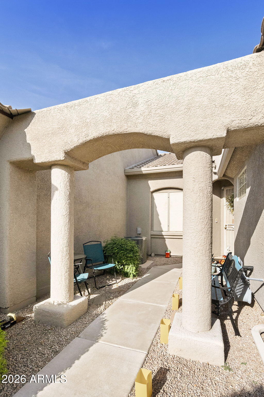 4202 East Broadway Road, Unit 80 Mesa, AZ 85206 - Photo 34 of 68 a front view of a house with outdoor seating