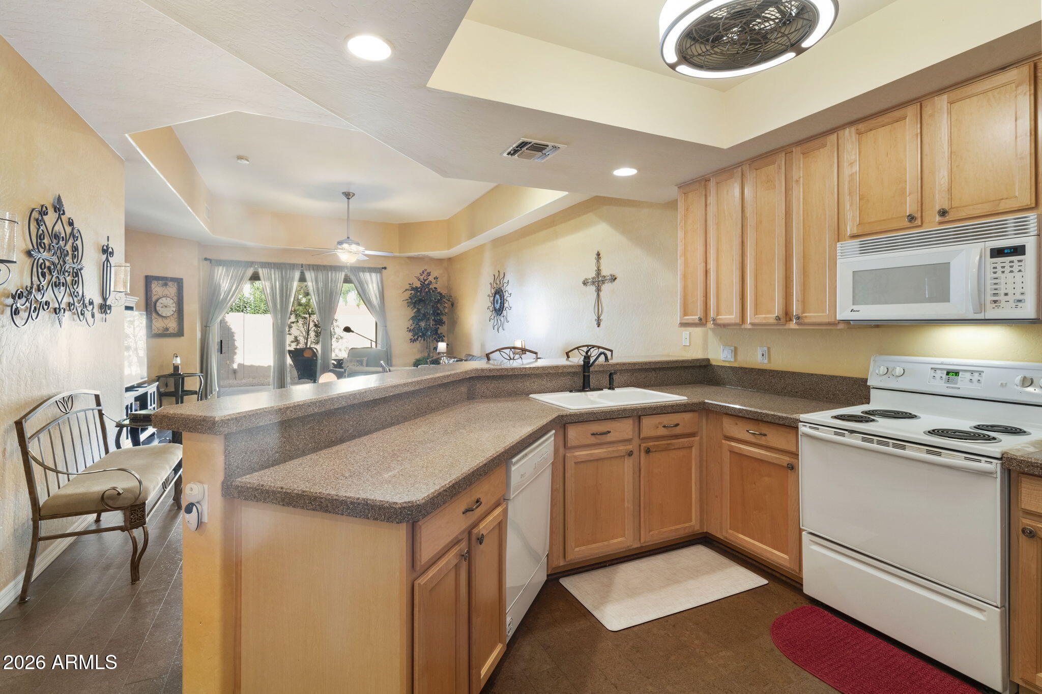 4202 East Broadway Road, Unit 80 Mesa, AZ 85206 - Photo 4 of 68 a kitchen with a sink stove and cabinets