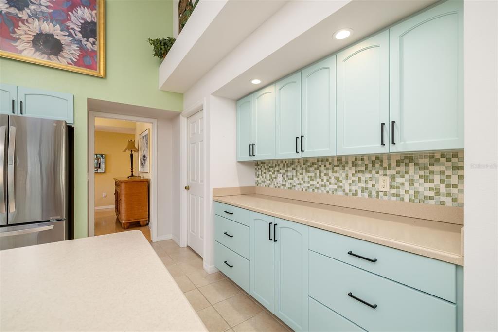 4480 Ascot Circle South Sarasota, FL 34235 - Photo 15 of 76 a kitchen with granite countertop white cabinets and stainless steel appliances
