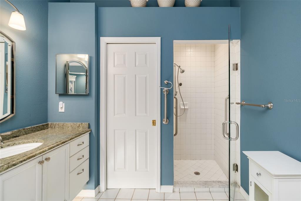 4480 Ascot Circle South Sarasota, FL 34235 - Photo 22 of 76 a bathroom with a granite countertop sink toilet and shower