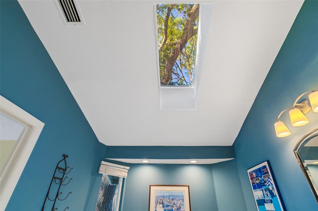4480 Ascot Circle South Sarasota, FL 34235 - Photo 24 of 76 a view of a hallway to a window