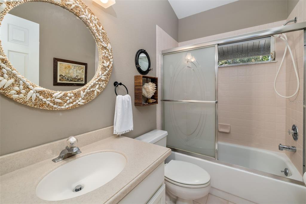 4480 Ascot Circle South Sarasota, FL 34235 - Photo 29 of 76 a bathroom with a toilet sink and shower