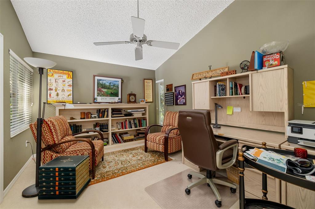 4480 Ascot Circle South Sarasota, FL 34235 - Photo 31 of 76 a workspace with furniture