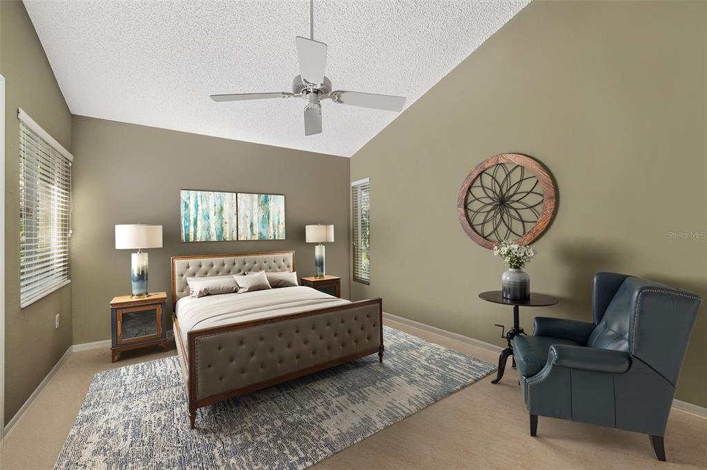 4480 Ascot Circle South Sarasota, FL 34235 - Photo 32 of 76 a bedroom with a bed a chandelier fan and a window