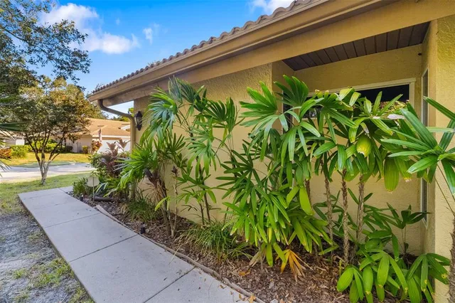 a view of people sitting in front of retail shops