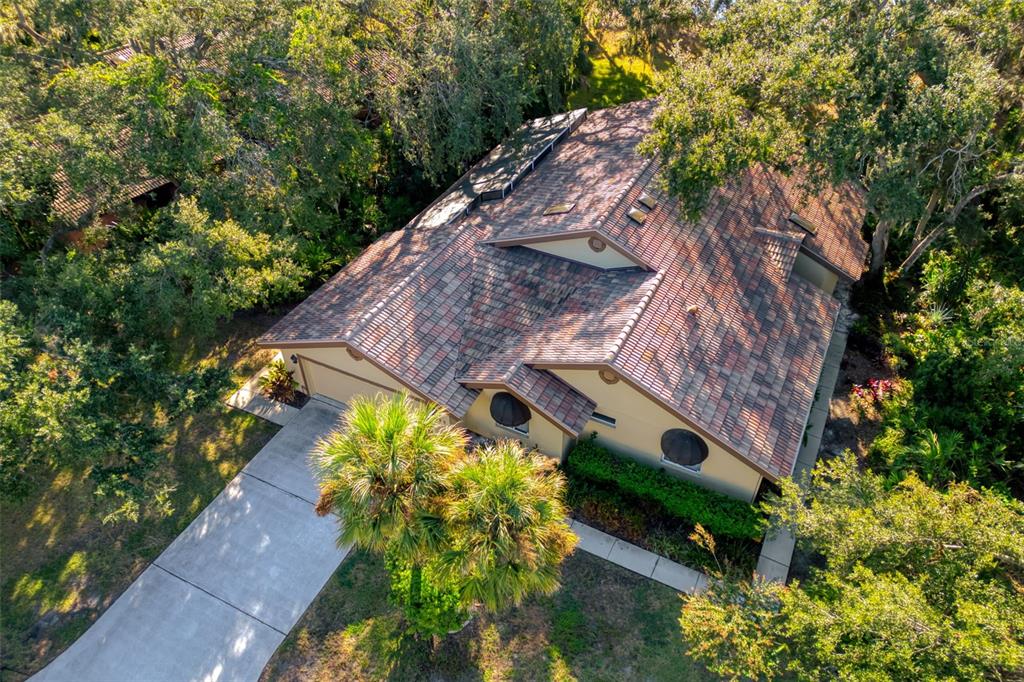 4480 Ascot Circle South Sarasota, FL 34235 - Photo 46 of 76 an aerial view of a house with a yard
