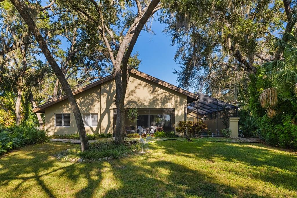 4480 Ascot Circle South Sarasota, FL 34235 - Photo 51 of 76 a view of a house with a yard