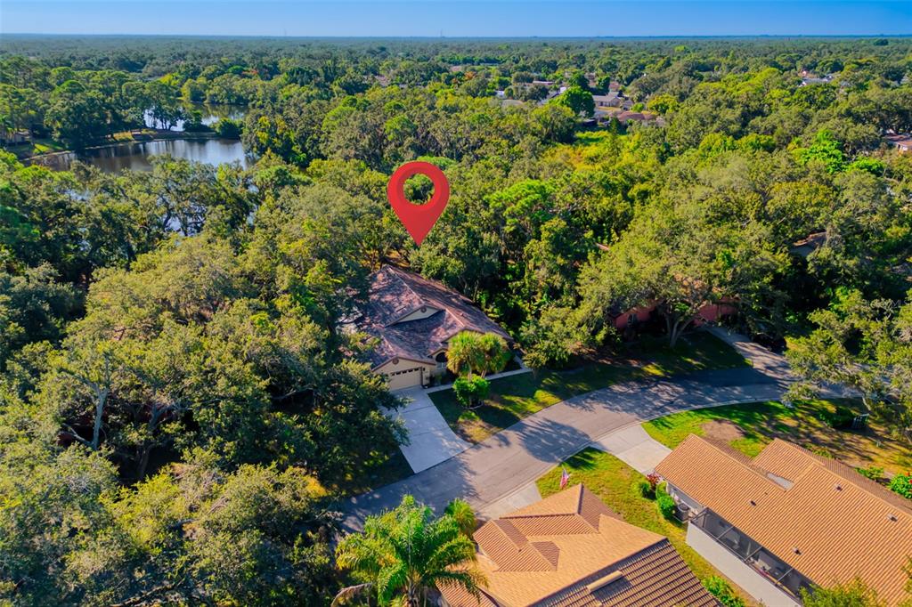 4480 Ascot Circle South Sarasota, FL 34235 - Photo 52 of 76 an aerial view of a house with a yard basket ball court