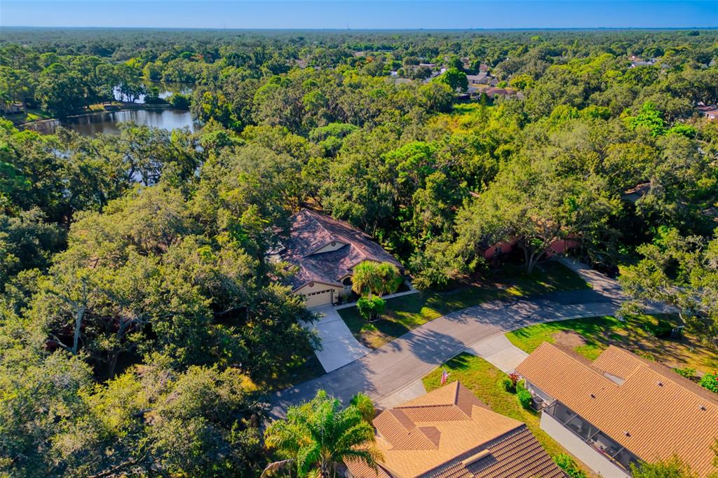 4480 Ascot Circle South Sarasota, FL 34235 - Photo 53 of 76 an aerial view of residential houses with outdoor space and trees