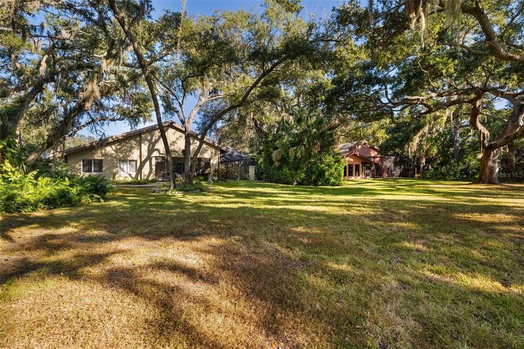 4480 Ascot Circle South Sarasota, FL 34235 - Photo 58 of 76 a view of outdoor space with trees all around