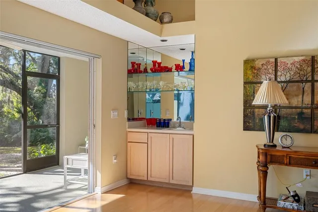 a view of a dining room with furniture and chandelier