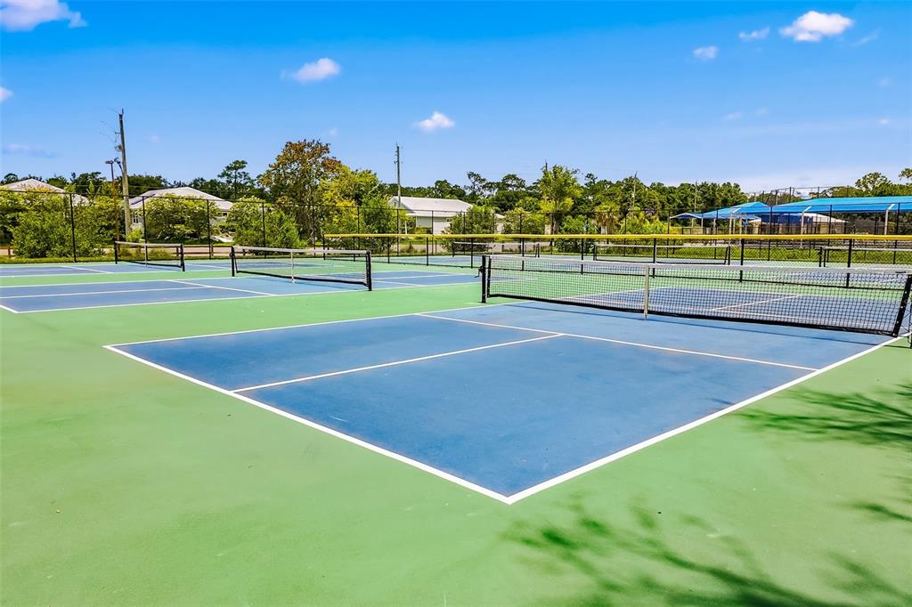 4480 Ascot Circle South Sarasota, FL 34235 - Photo 71 of 76 a view of a tennis court