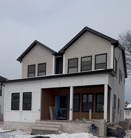 a view of a house with large windows