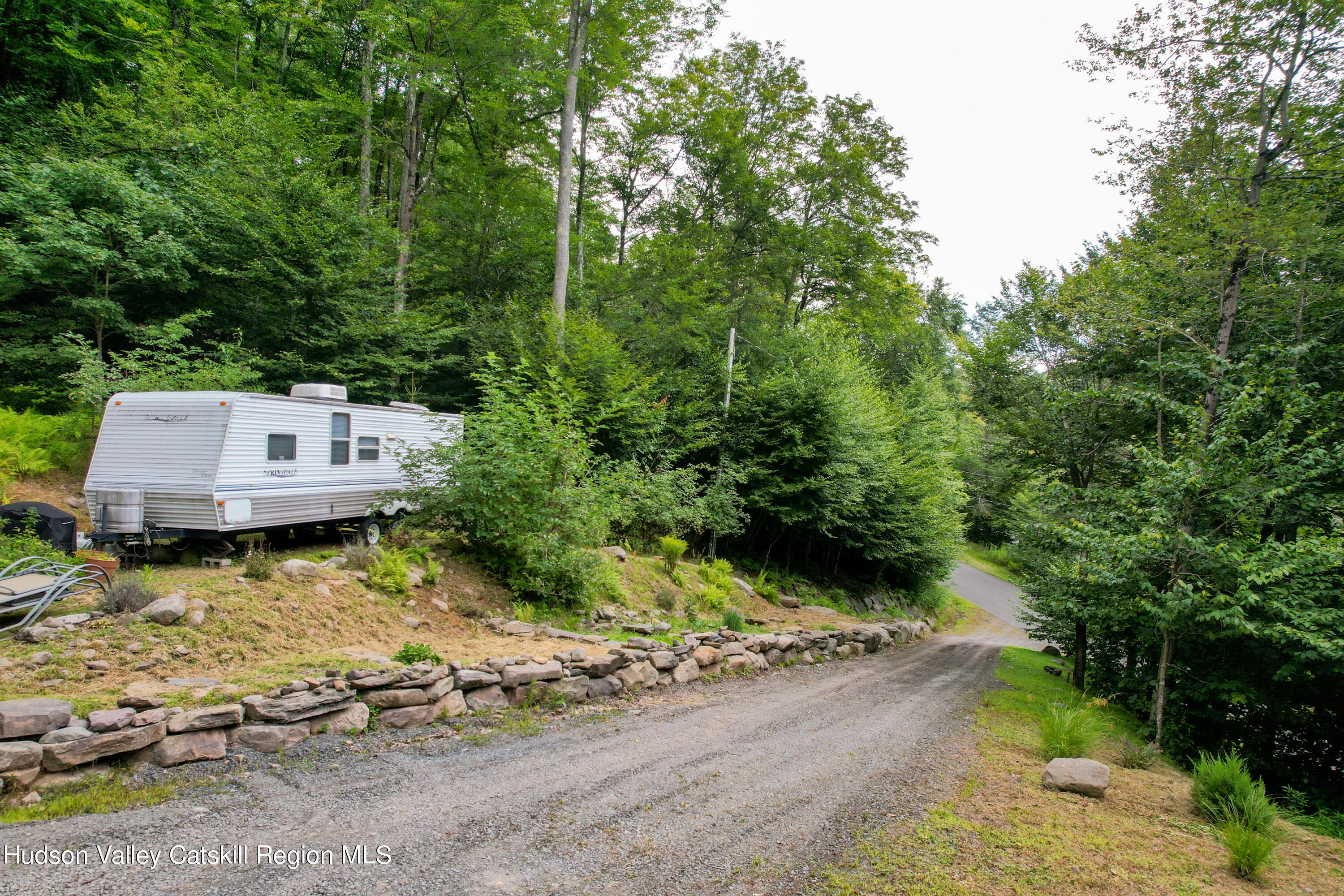 208 Pantherkill Road Phoenicia, NY 12464 - Photo 12 of 16 a view of house with yard and trees in the background