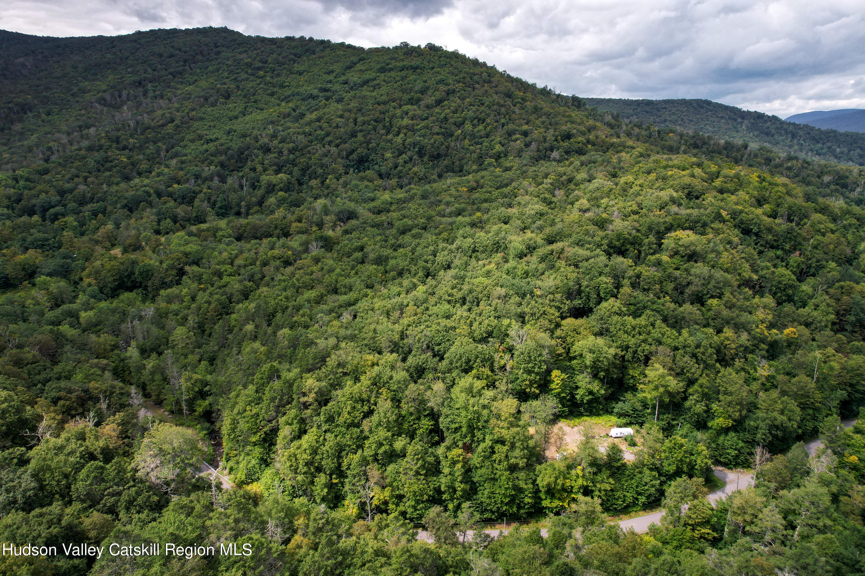 208 Pantherkill Road Phoenicia, NY 12464 - Photo 9 of 16 a view of a mountain range with lush green forest