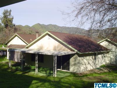 41085 Oak Ridge Drive Three Rivers, CA 93271 - Photo 4 of 6 a view of a house with a yard