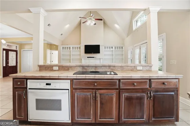 a kitchen with a stove and cabinets