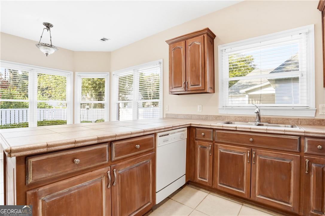 171 West Commons Drive St. Simons, GA 31522 - Photo 14 of 39 a kitchen with sink and window