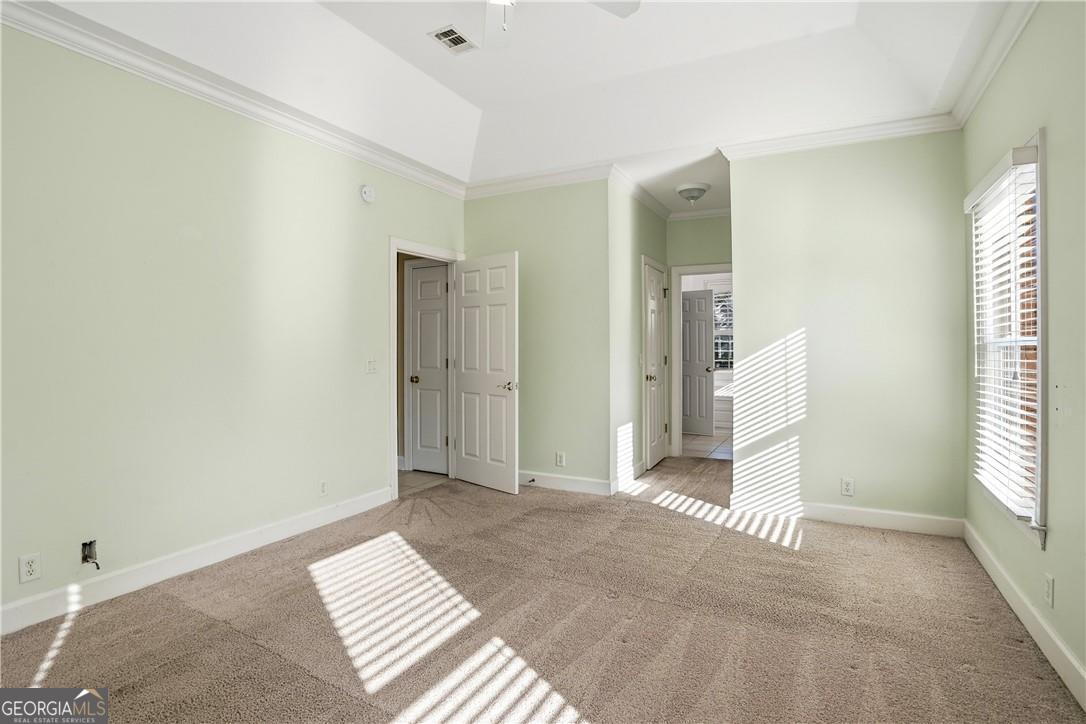 171 West Commons Drive St. Simons, GA 31522 - Photo 17 of 39 a view of a livingroom with wooden floor and windows