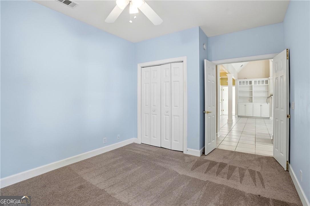 171 West Commons Drive St. Simons, GA 31522 - Photo 23 of 39 an empty room with windows