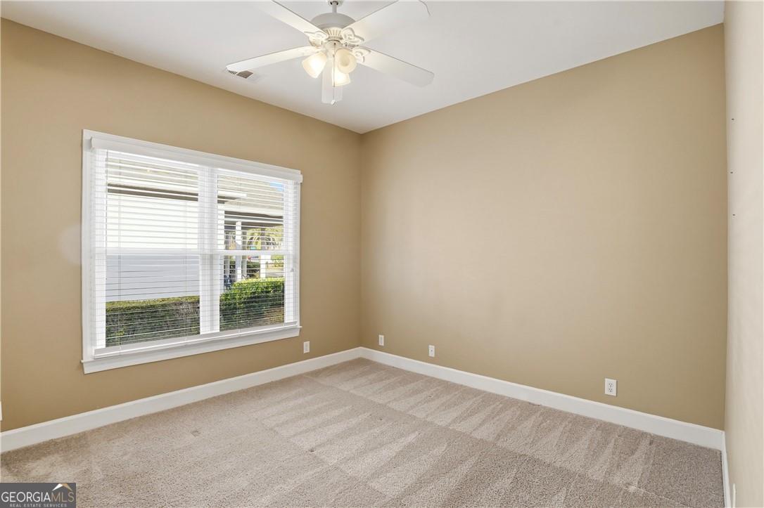 171 West Commons Drive St. Simons, GA 31522 - Photo 26 of 39 a view of an empty room with a window