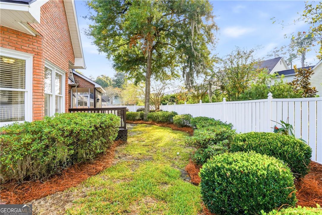171 West Commons Drive St. Simons, GA 31522 - Photo 38 of 39 a view of backyard with swimming pool and seating space