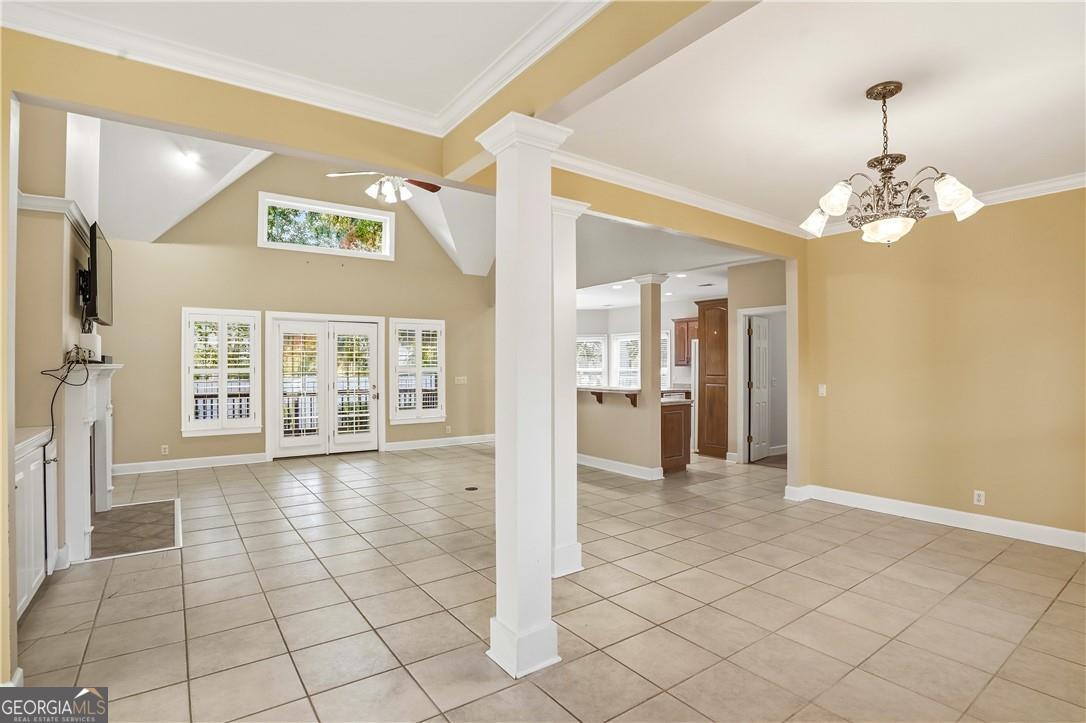 171 West Commons Drive St. Simons, GA 31522 - Photo 5 of 39 a view of a hallway with wooden floor and a living room