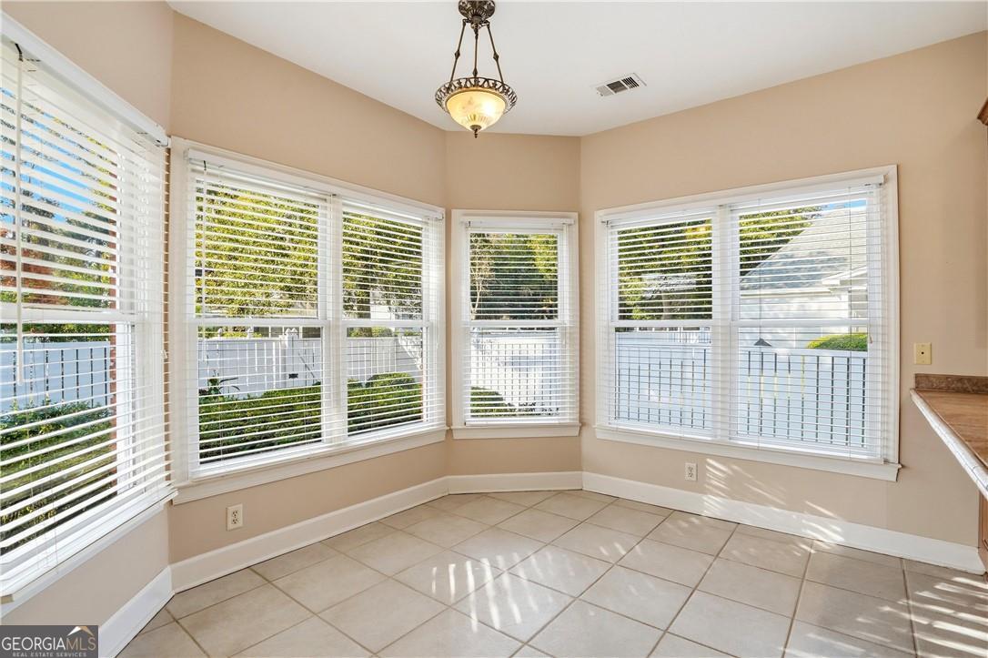 171 West Commons Drive St. Simons, GA 31522 - Photo 10 of 39 a view of an empty room with windows