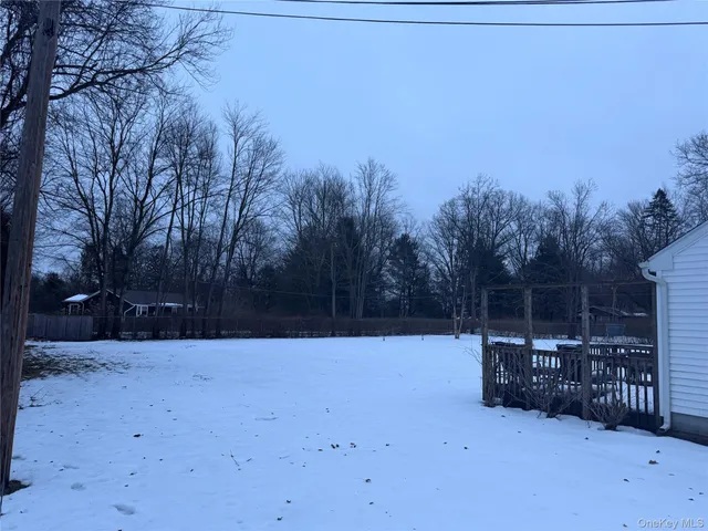 a view of outdoor space with wooden fence