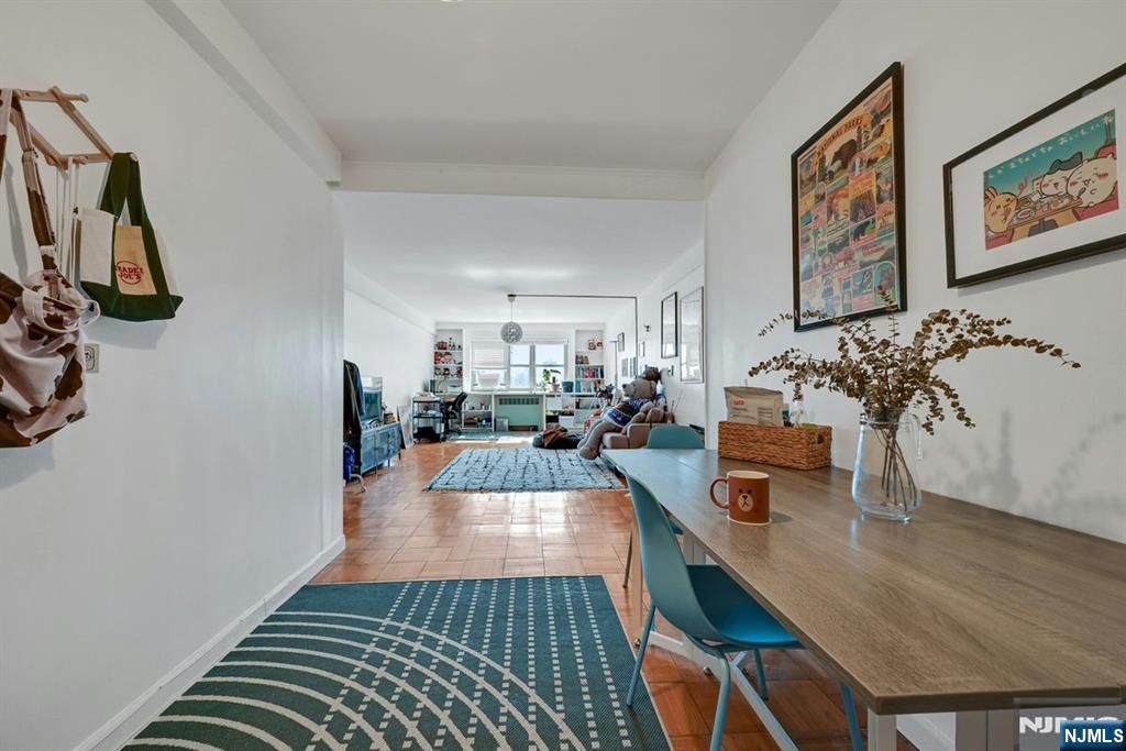 a living room with furniture and a rug