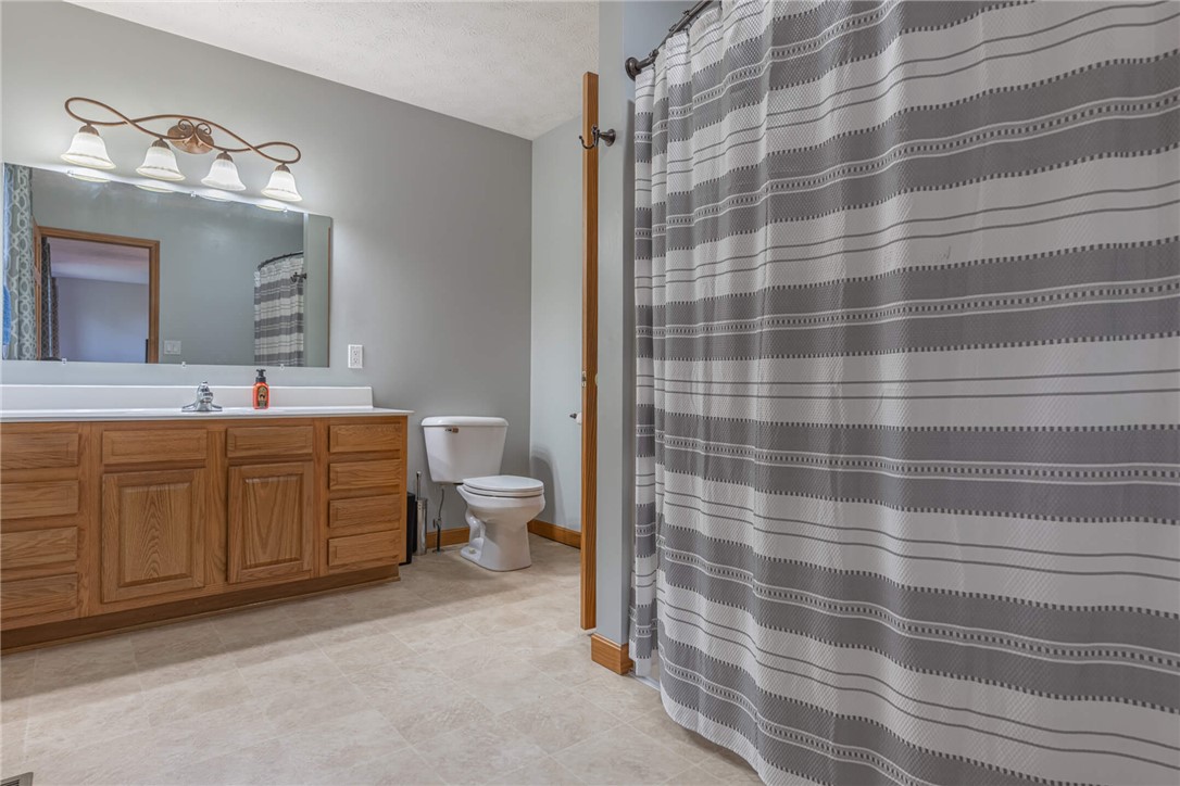 2645 Vance Road St. Paris, OH 43072 - Photo 25 of 35 Functional full bathroom with ample vanity space and classic tile flooring.
