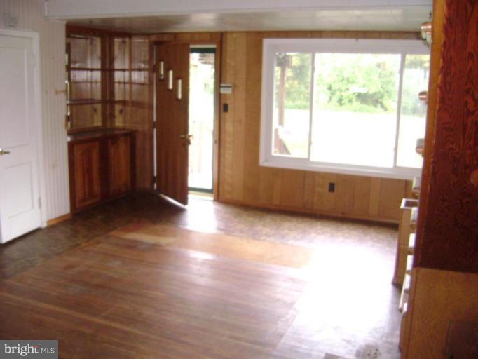 506 Meadow Road Baltimore, MD 21206 - Photo 3 of 10 a view of an empty room with a window