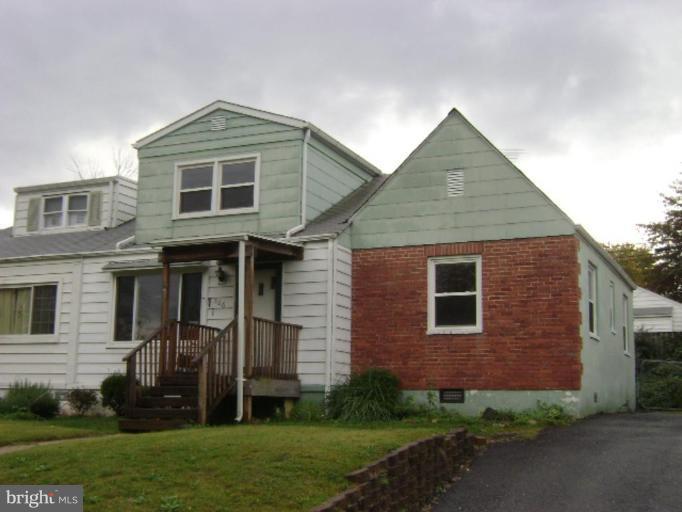 506 Meadow Road Baltimore, MD 21206 - Photo 6 of 10 a front view of a house with a garden