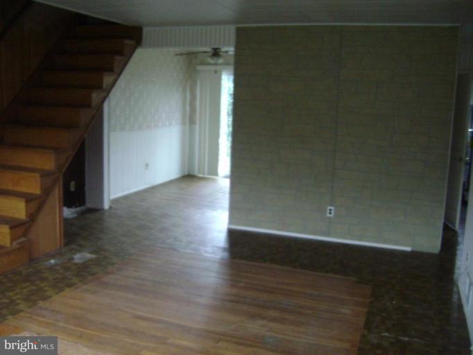 506 Meadow Road Baltimore, MD 21206 - Photo 7 of 10 a view of a small space with wooden floor and staircase