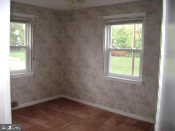 506 Meadow Road Baltimore, MD 21206 - Photo 9 of 10 an empty room with a window