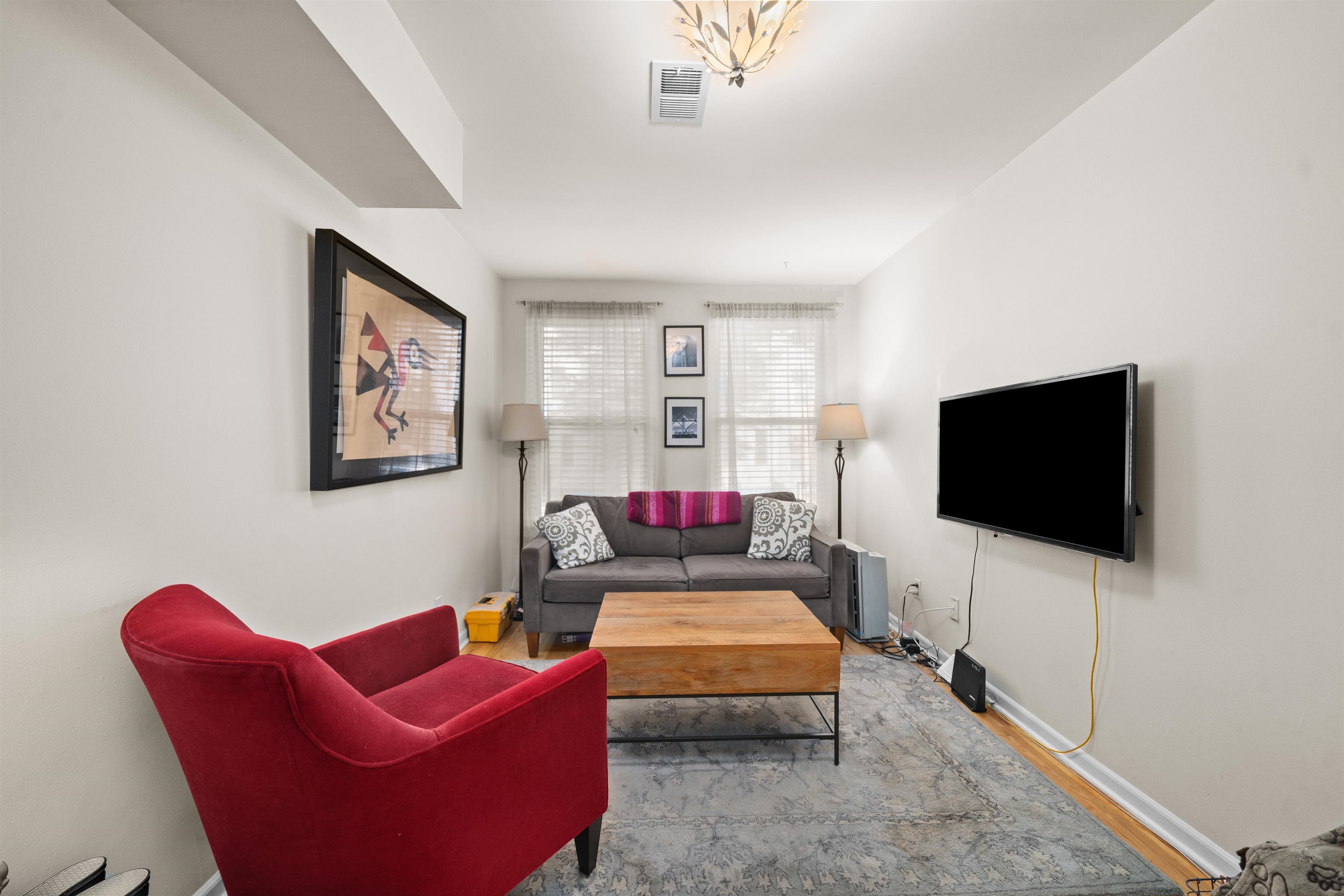 a living room with furniture and a flat screen tv