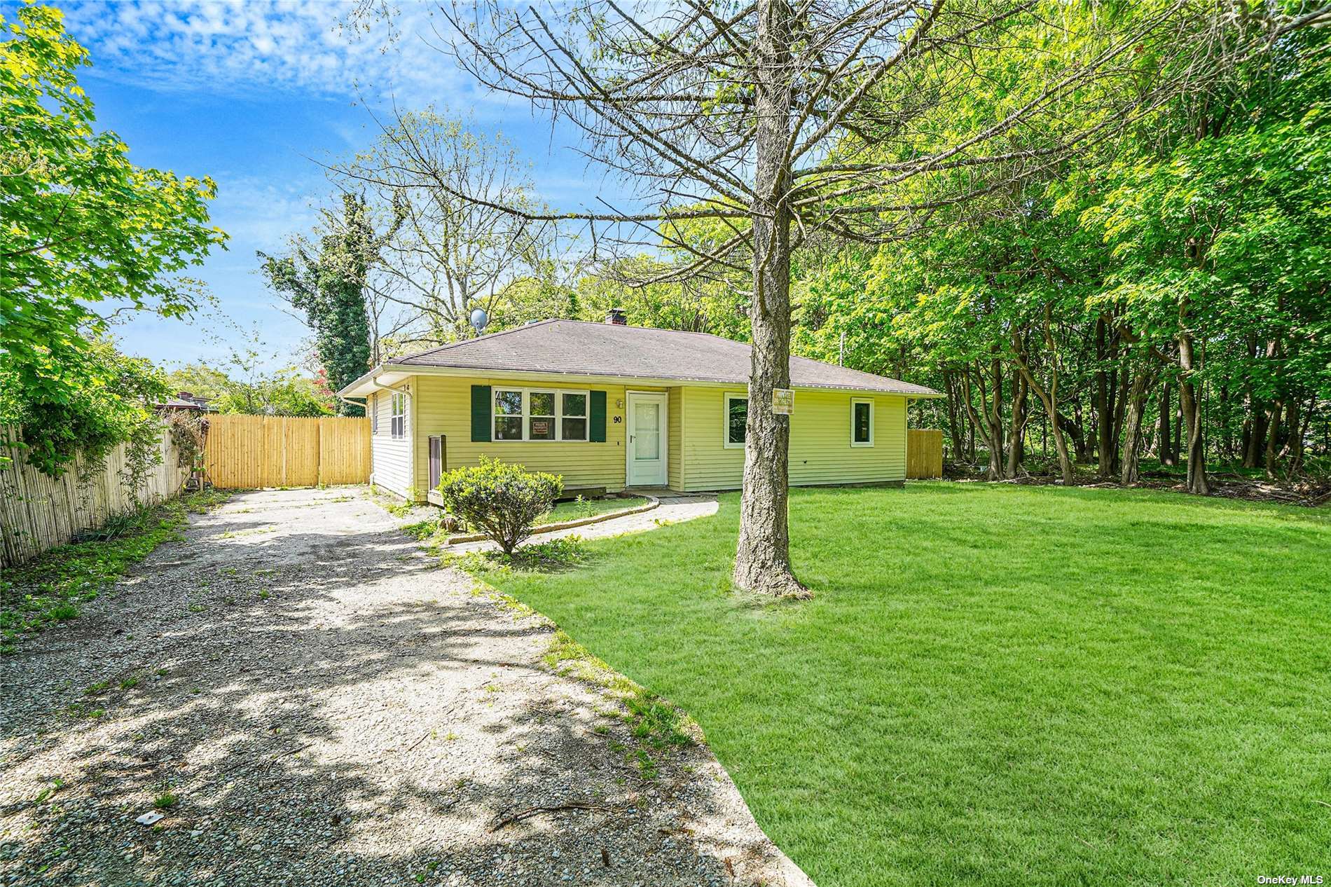 90 Beaver Dam Road Bellport, NY 11713 - Photo 1 of 1 a view of a house with a yard