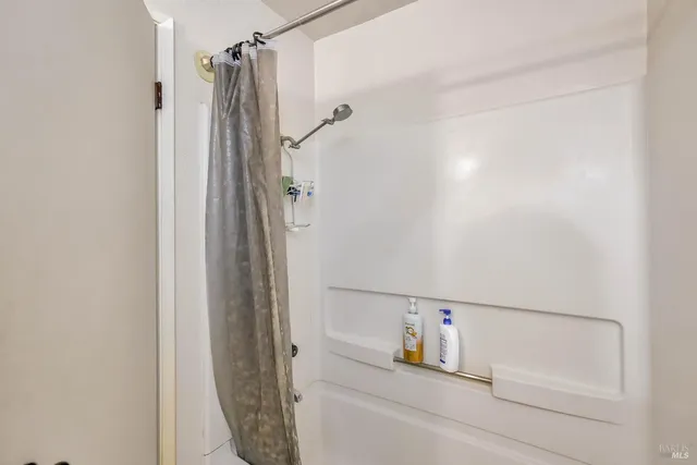 an aerial view of a house with swimming pool and garden