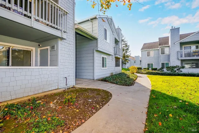 a bed room with a bed mirror and a dresser