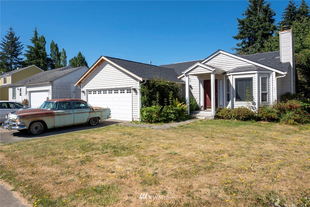 17733 114th Place Southeast Renton, WA 98055 - Photo 1 of 23 a front view of a house with a yard and garage