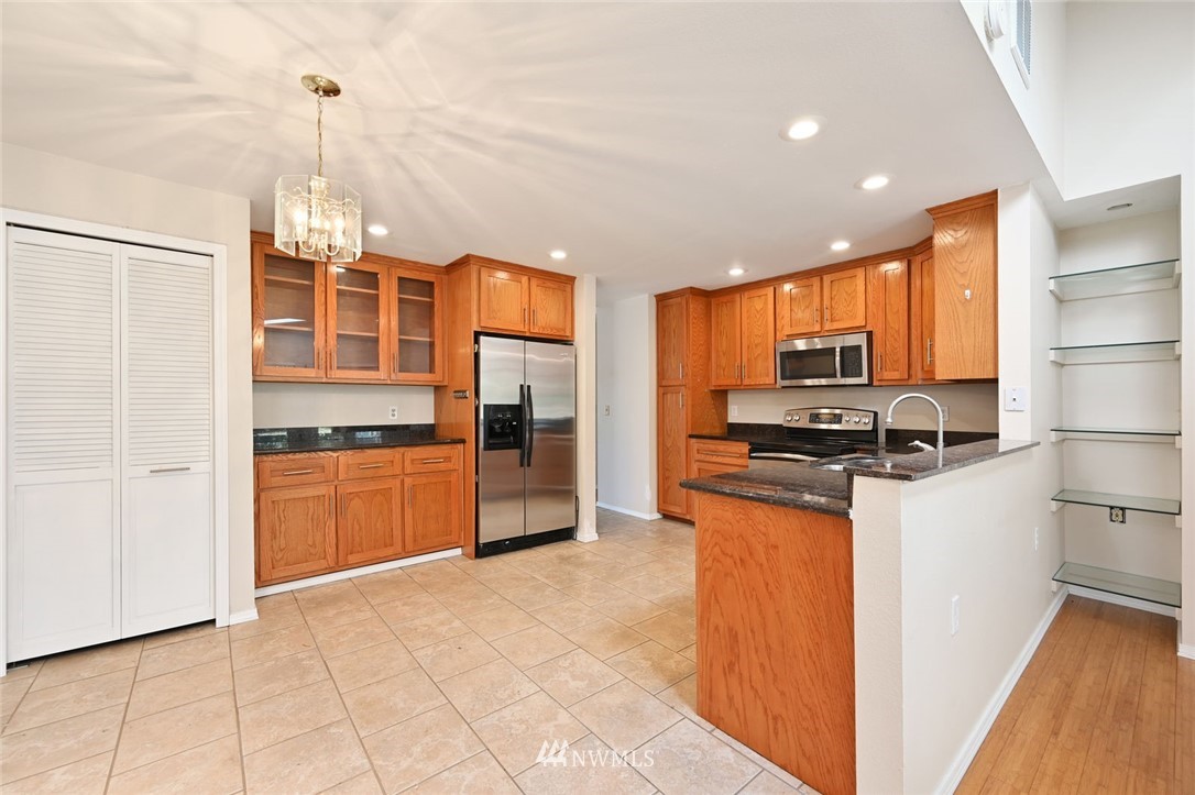 17733 114th Place Southeast Renton, WA 98055 - Photo 8 of 23 a kitchen with stainless steel appliances a refrigerator sink and microwave