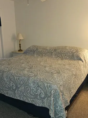 a view of a room with a bed