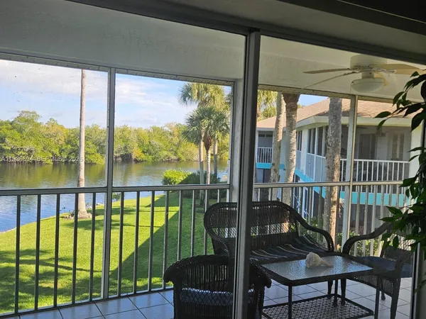 a view of a balcony with furniture
